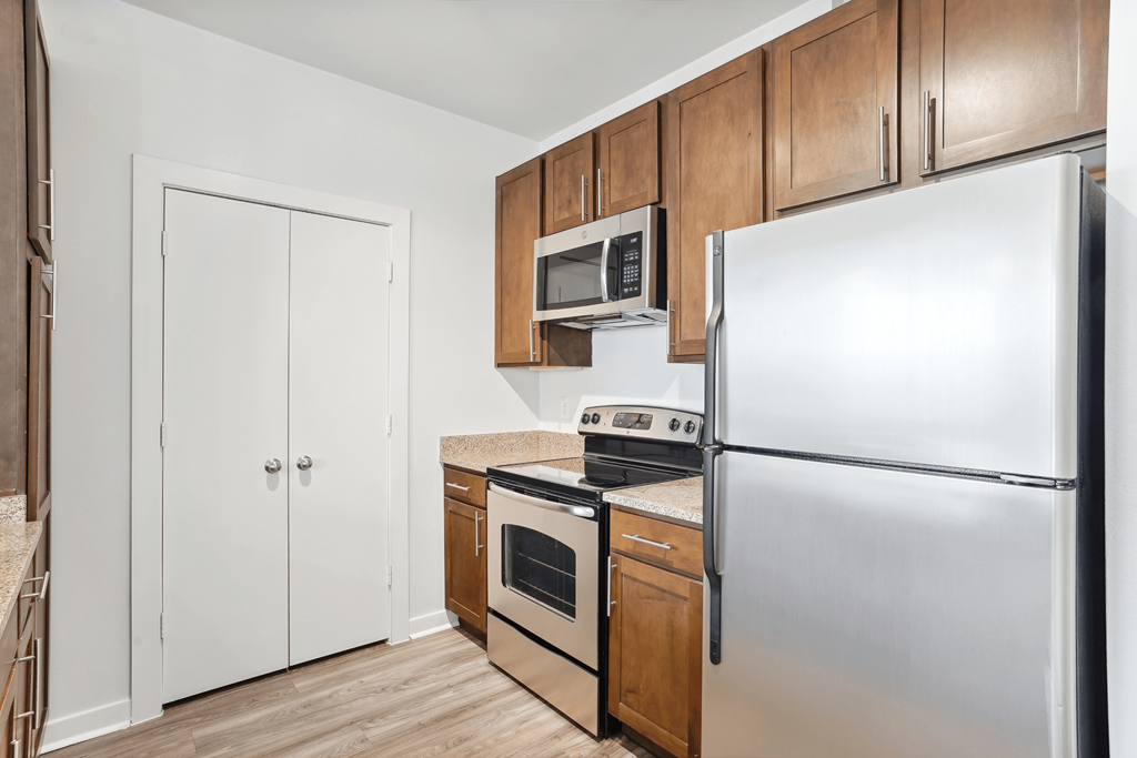Newly Renovated Interiors with Hardwood Style Flooring, Stainless Steel Appliances, and Granite Countertops