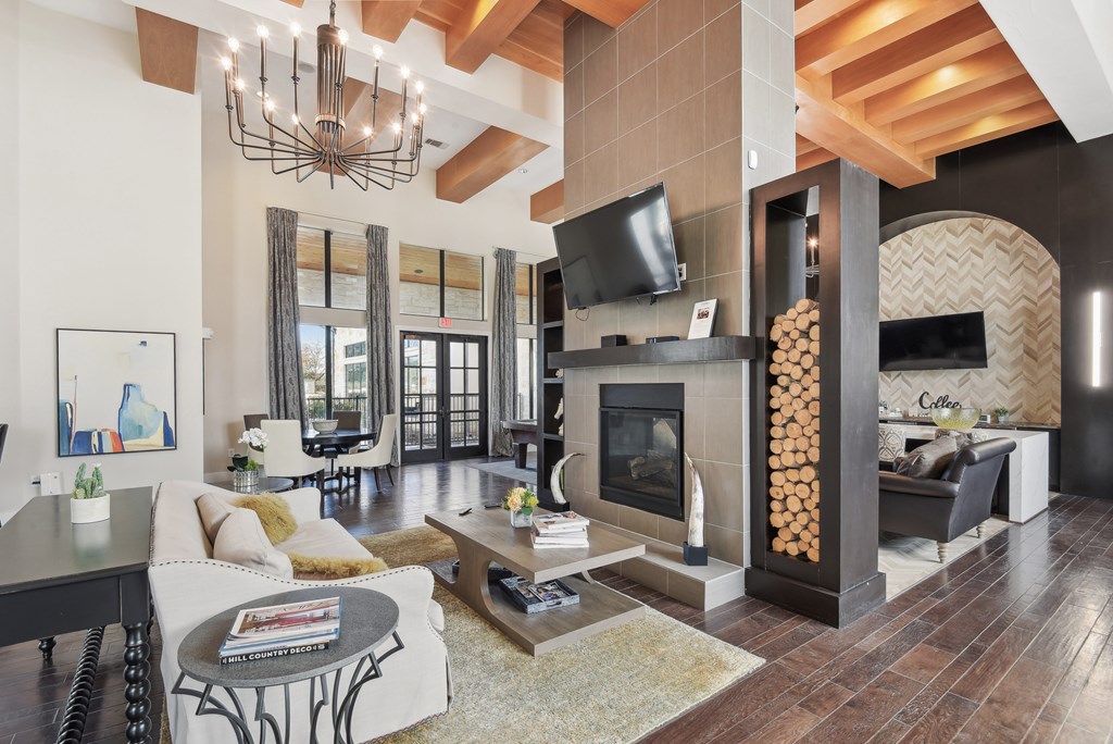 a living room with a fireplace and a television