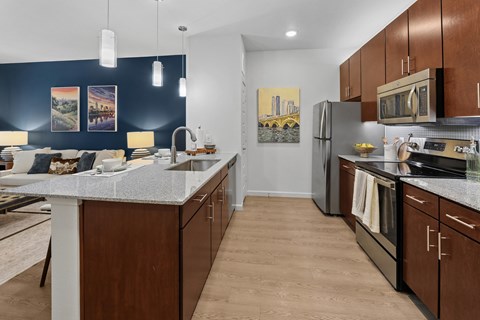 A kitchen with brown cabinets and a white countertop.