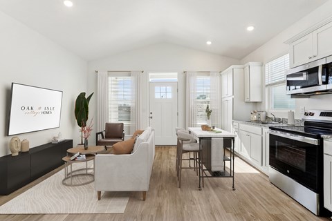 A modern kitchen with a dining table and chairs.