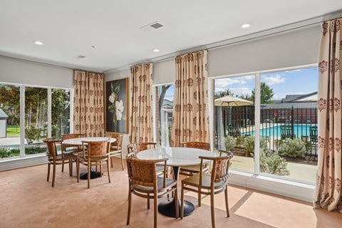 A dining room with a table and chairs at Towns at Chapel Hill in Plano Texas