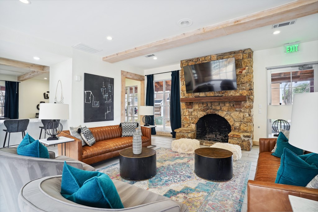 Resident lounge with billiards table, seating area, and entertainment kitchen