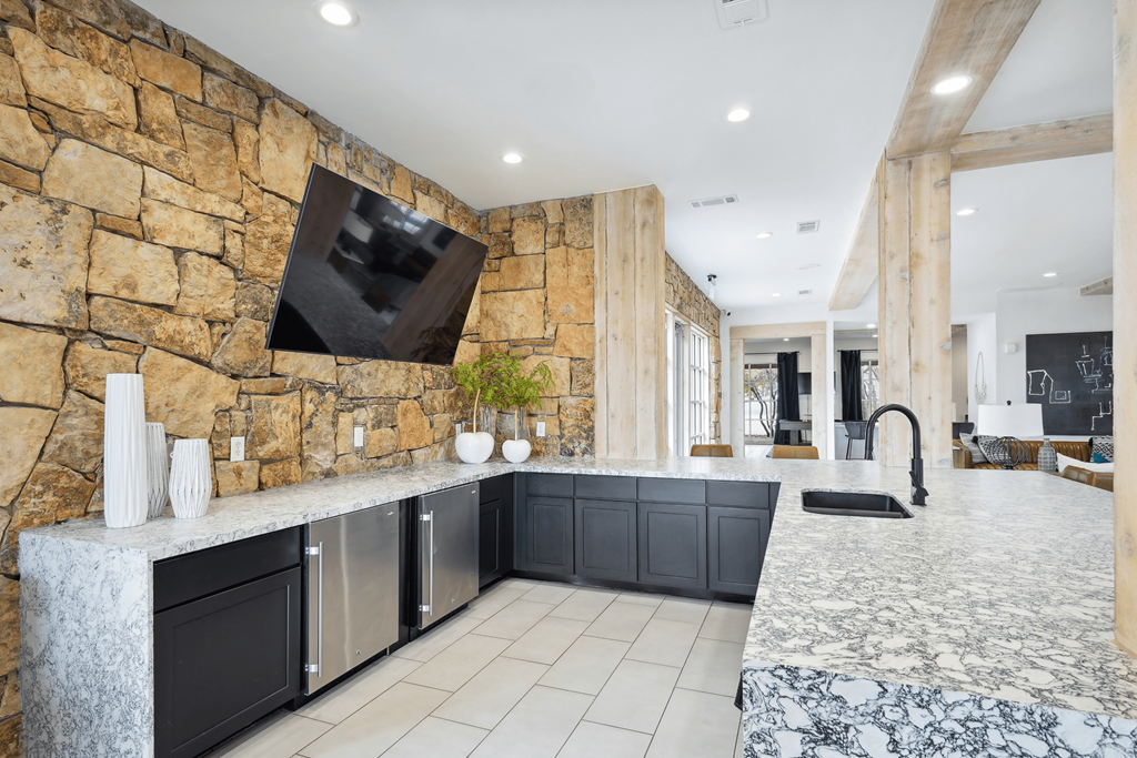 Resident lounge with billiards table and entertainment kitchen