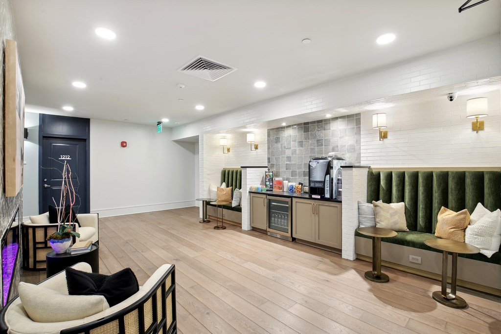 a living room with a kitchen and a couch