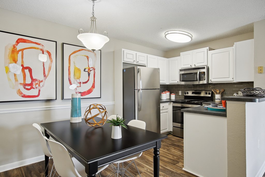 our spacious kitchen and dining area at the district flats apartments in lenexa
