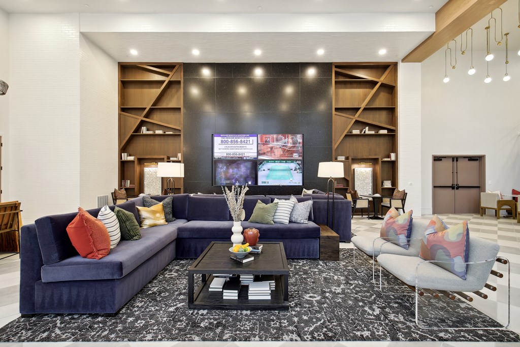 a living room with couches and a coffee table