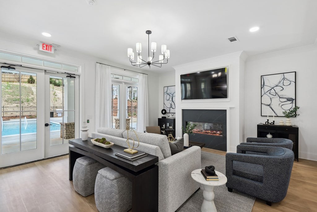 a living room with a fireplace and a tv