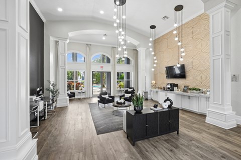 A modern living room with a black and white color scheme.