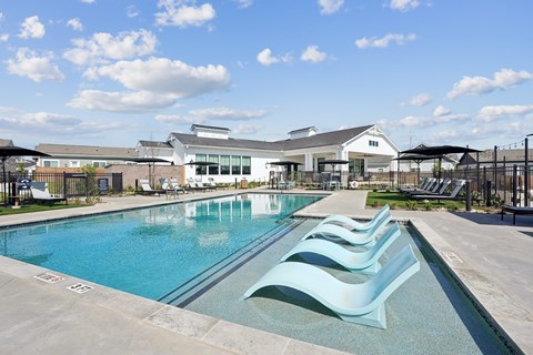 A large outdoor swimming pool with a modern design.
