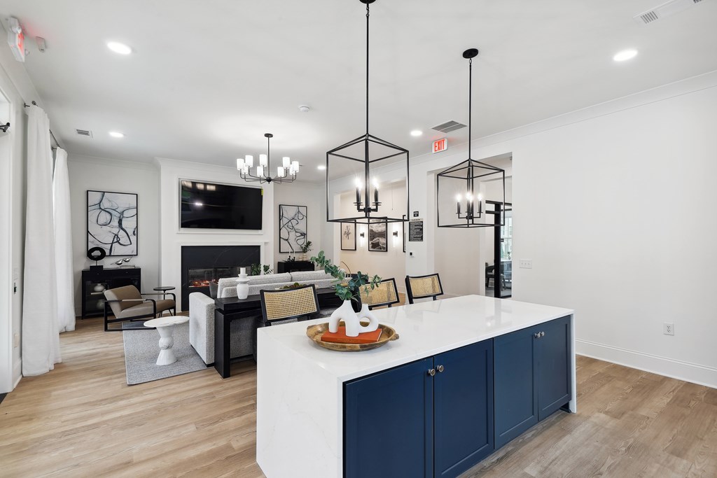 an open living room with a kitchen and a living room