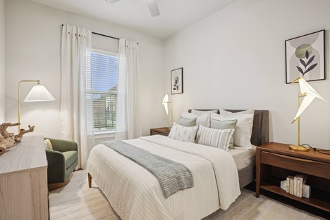 a bedroom with a bed and a window