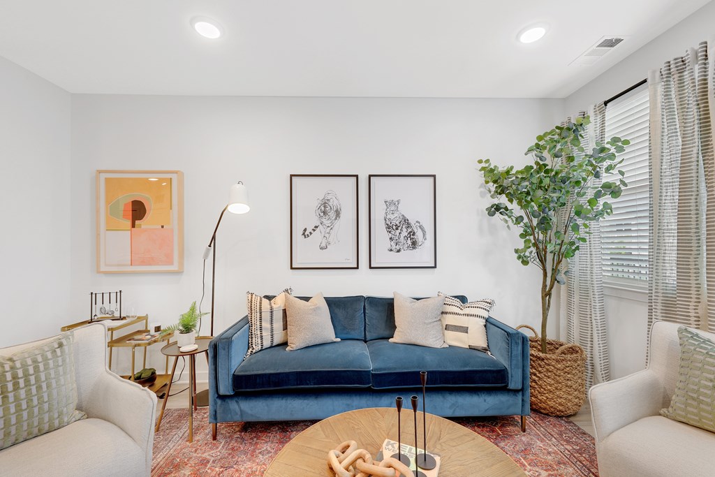 a living room with a blue couch