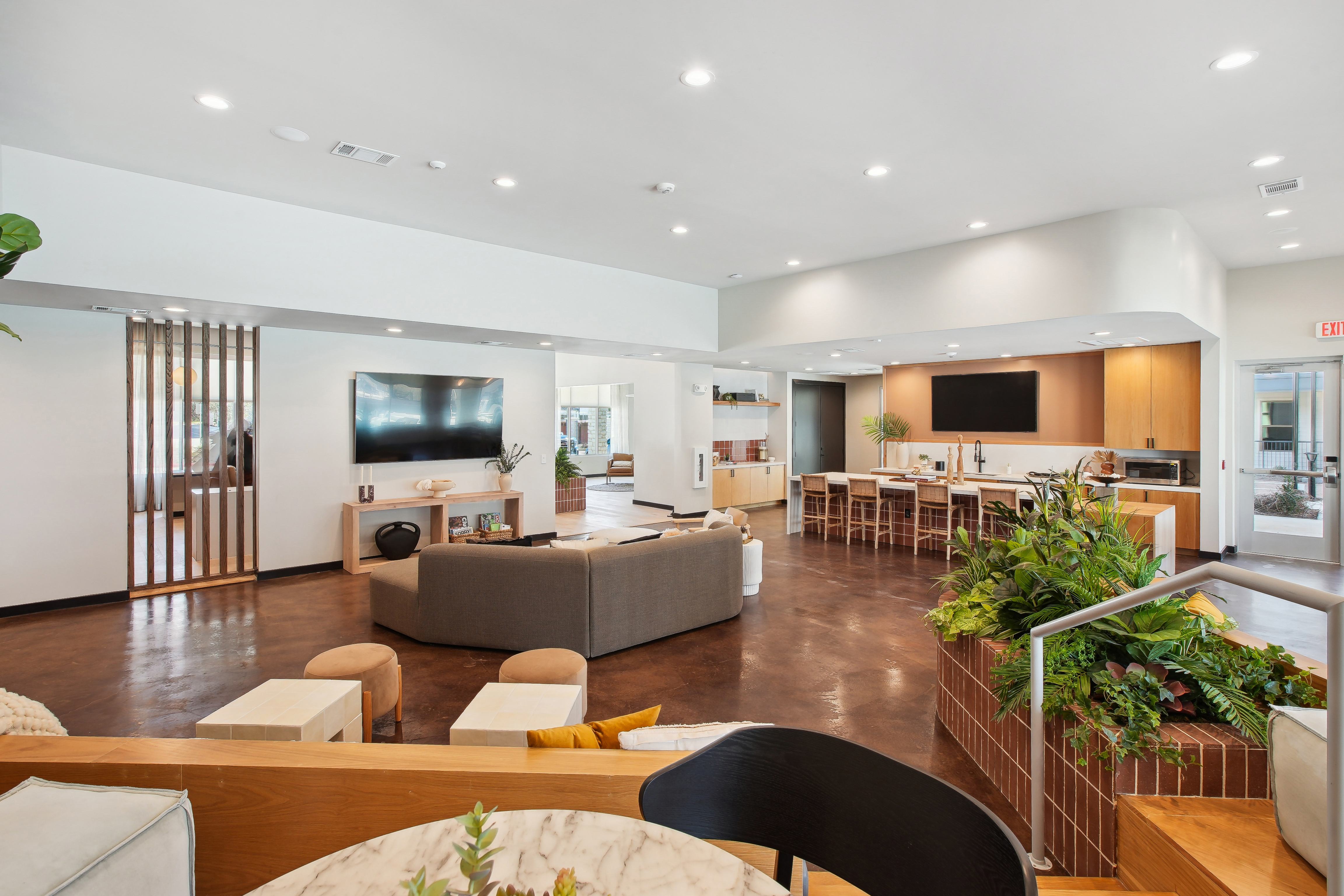 a living room and dining room with furniture and a television