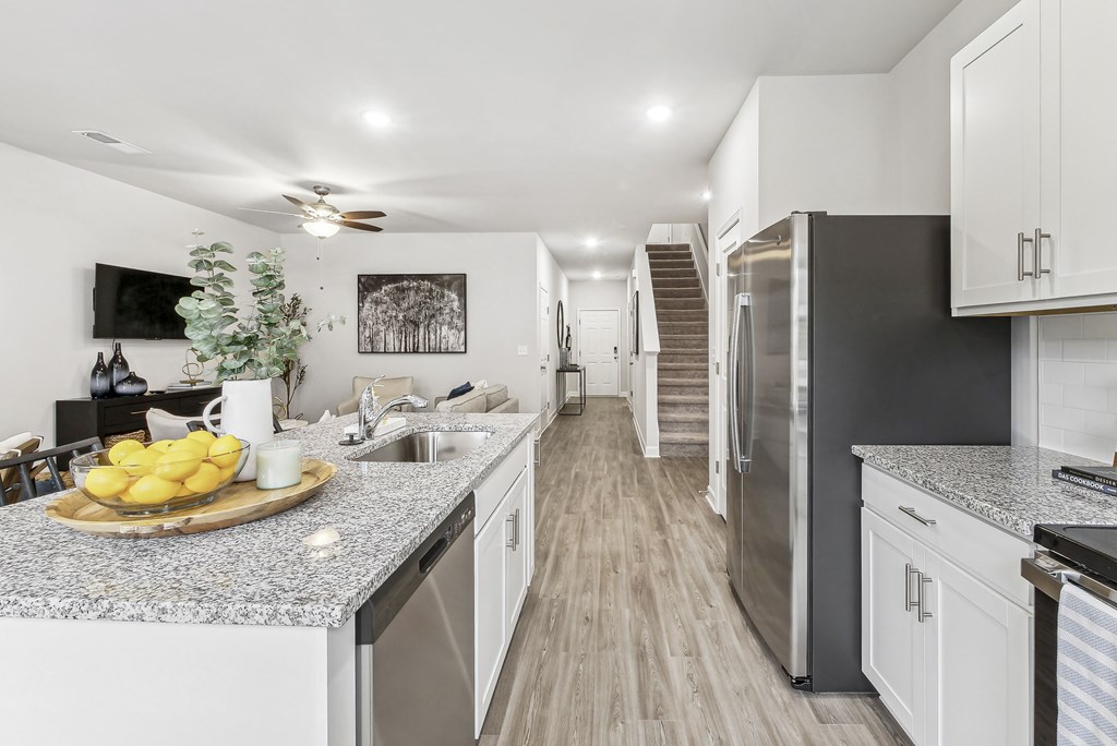 a kitchen with stainless steel appliances and granite counter tops