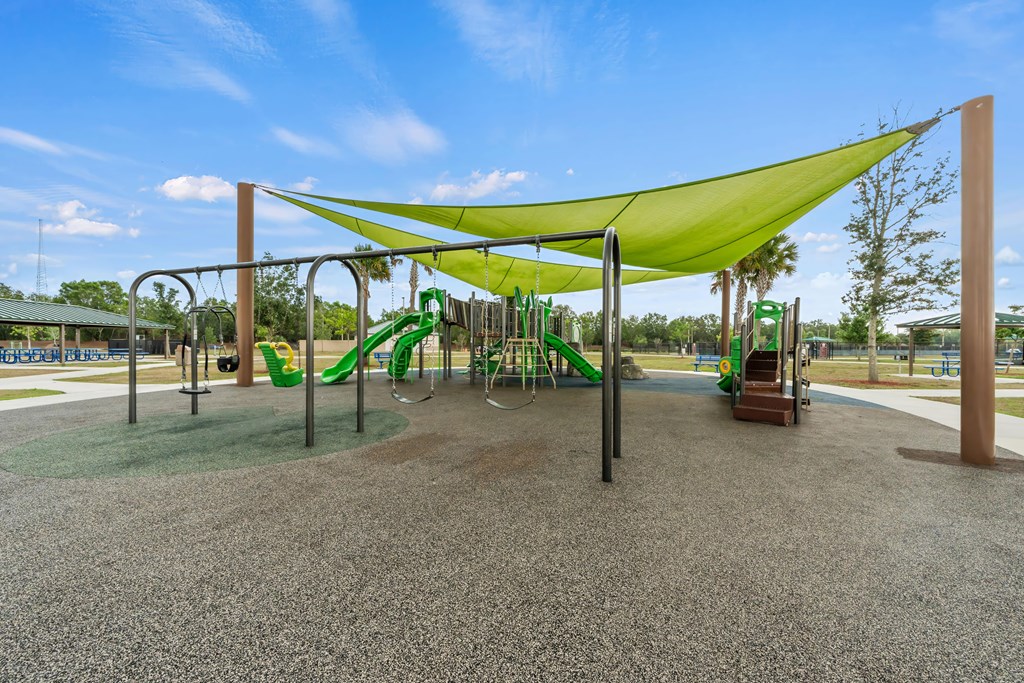 a playground with a swing set and other play equipment