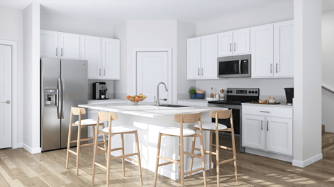 A kitchen with white cabinets and a white island with three bar stools.