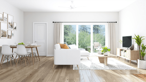 A modern living room with a dining table and chairs.