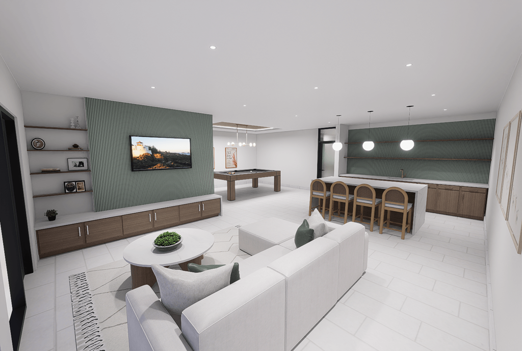 A modern living room with a white sofa and a television on the wall.