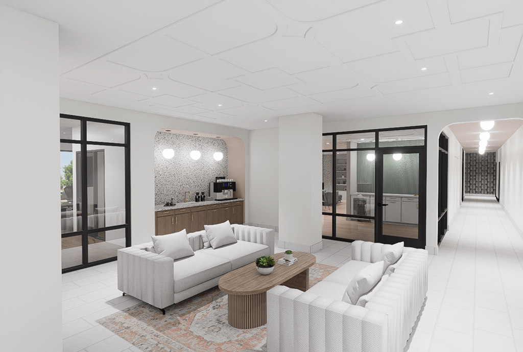 A modern living room with a white sofa and a wooden coffee table.