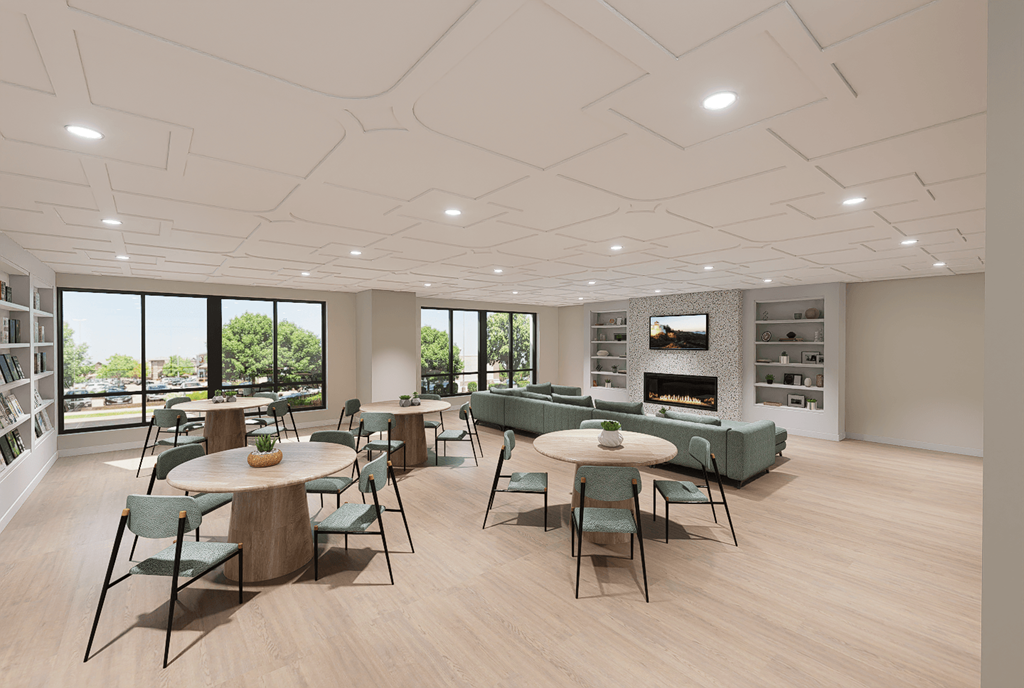 A modern dining room with a fireplace and a view of the outdoors.