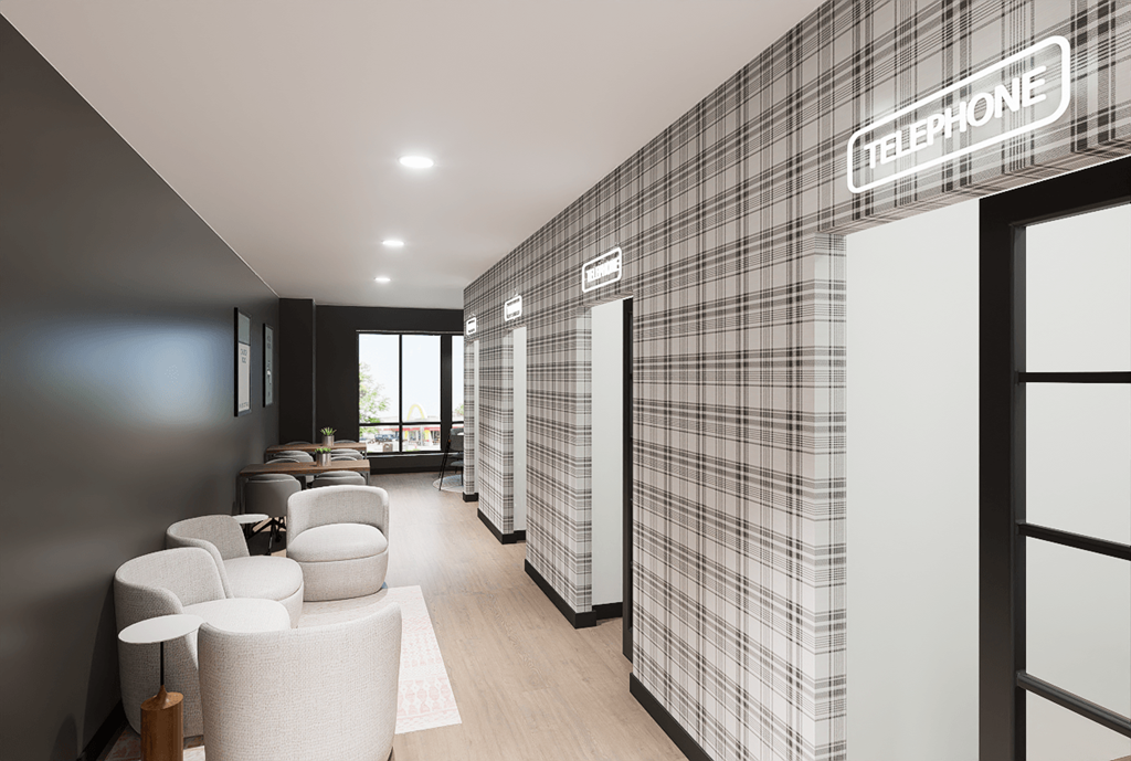 A modern office with a telephone sign on the wall.