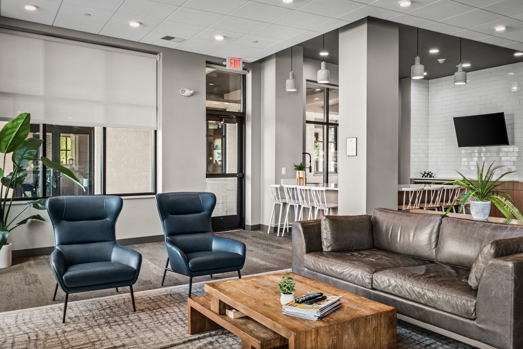 a lobby with couches chairs and a coffee table