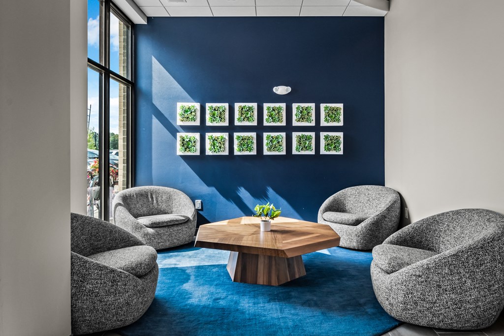 a group of chairs and a table in a room