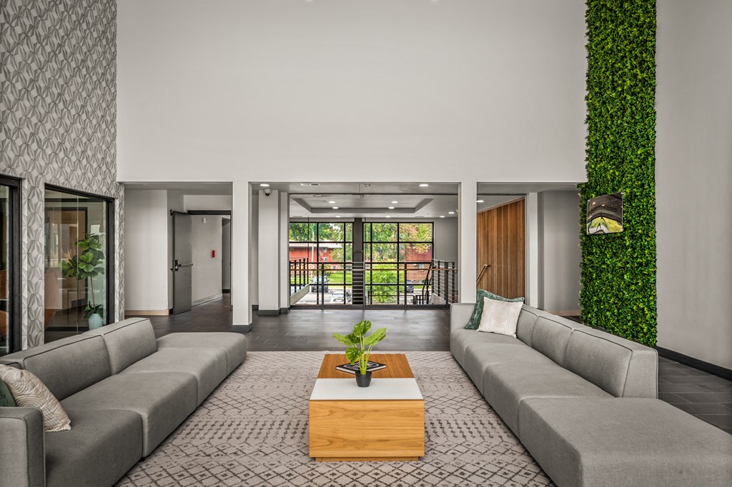 a living room with a gray couch and a coffee table