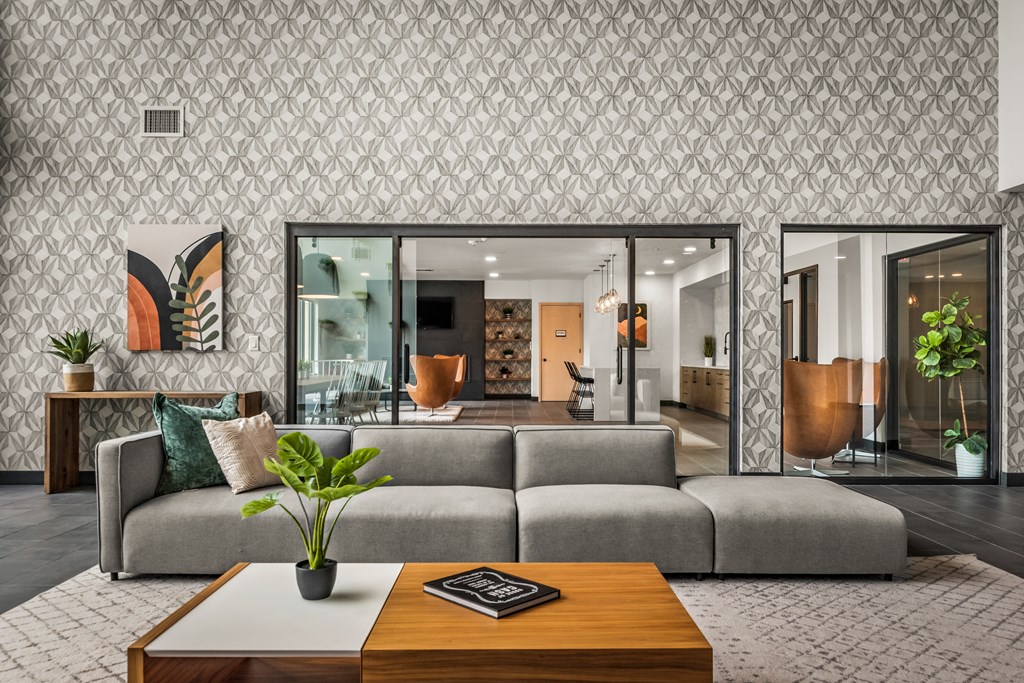 a living room with a gray couch and a coffee table