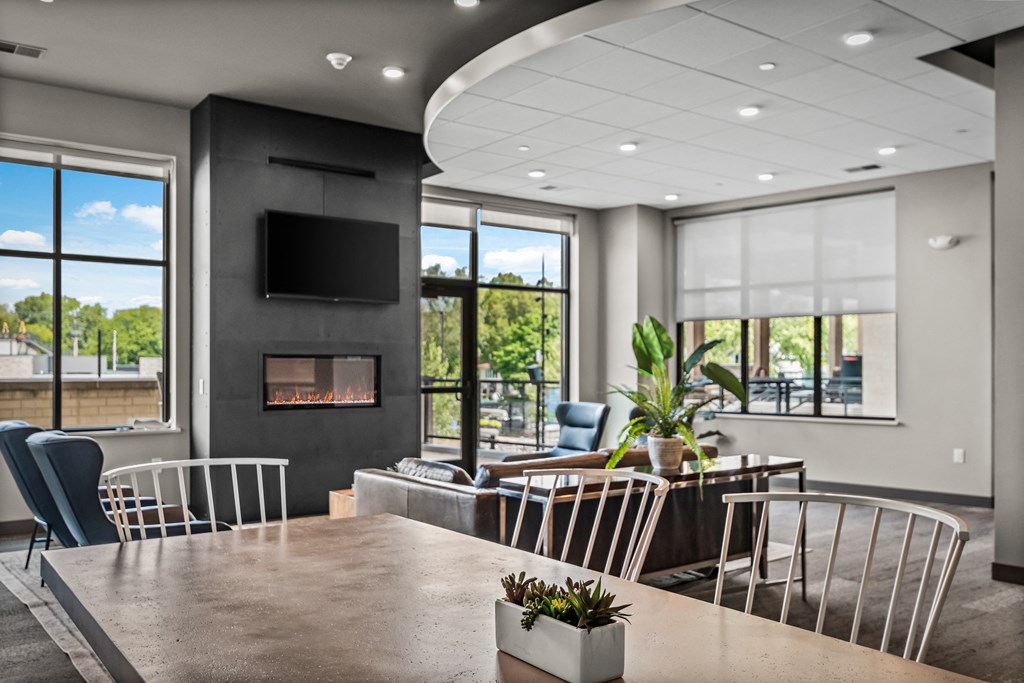 a conference room with a table and chairs and a fireplace