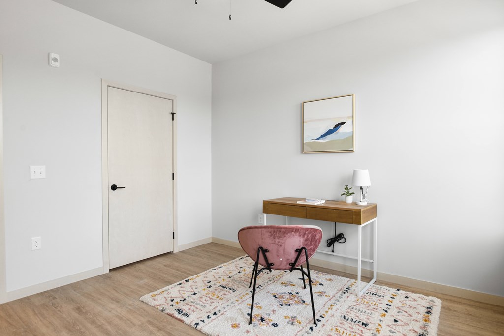 A room with a desk and chair.