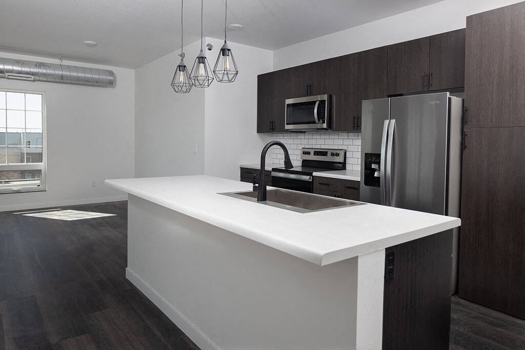 Kitchen with cabinets at The Landing at 1001 NP, Fargo, ND 58102
