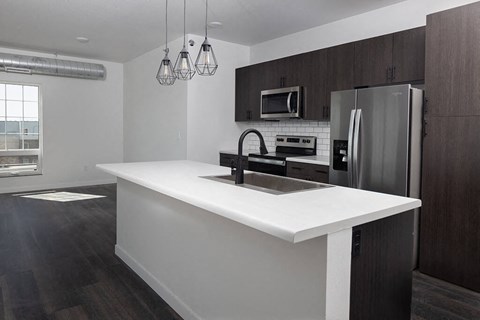 Kitchen with cabinets at The Landing at 1001 NP, Fargo, ND 58102