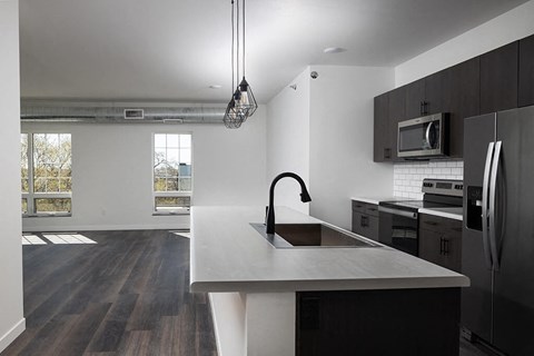 Kitchen with appliances at The Landing at 1001 NP, Fargo, ND 58102