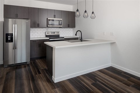Kitchen in living room at The Landing at 1001 NP, Fargo, ND 58102