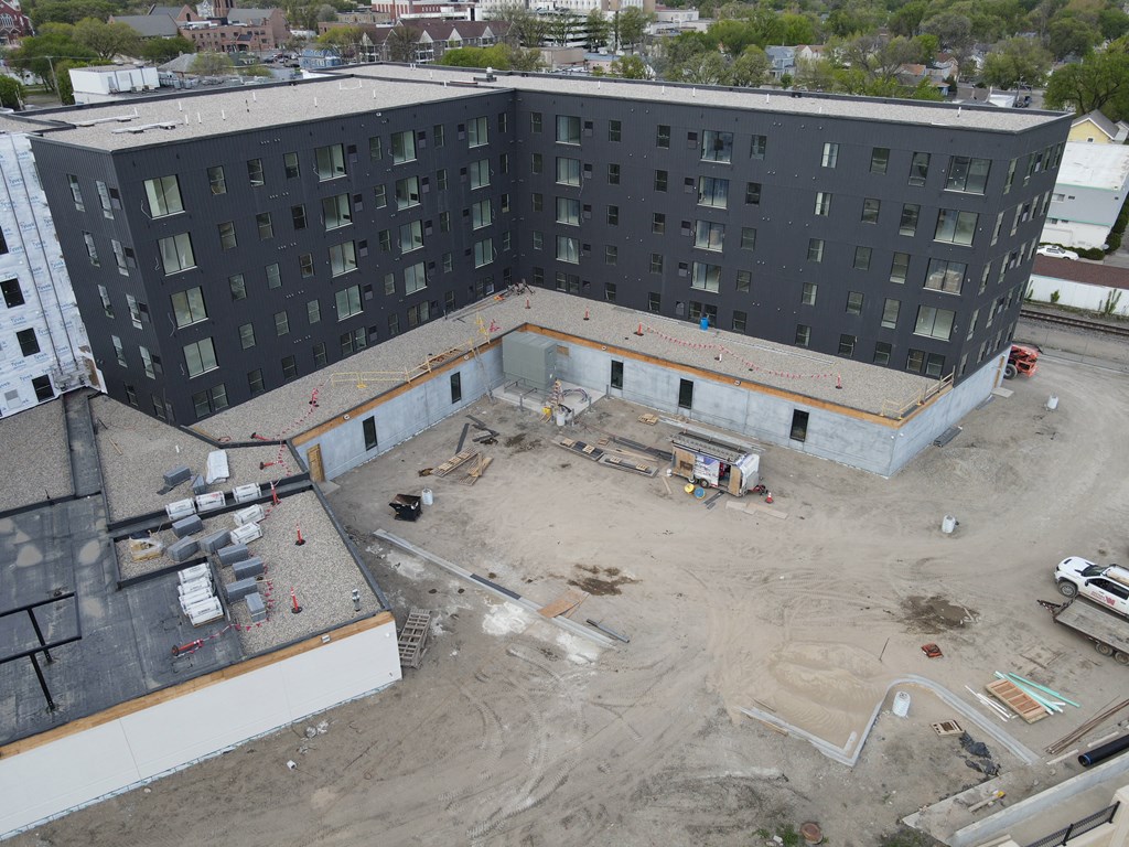 an aerial view of a building under construction in a city