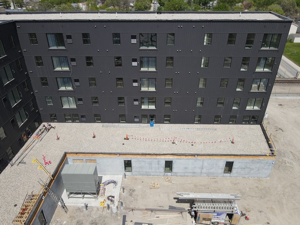 a view of a building from the top of a roof