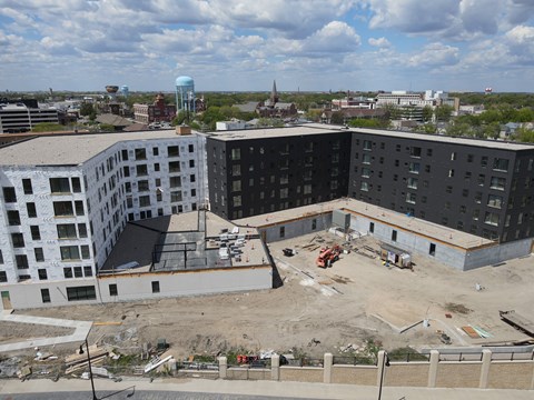 an aerial view of a building being constructed in a city