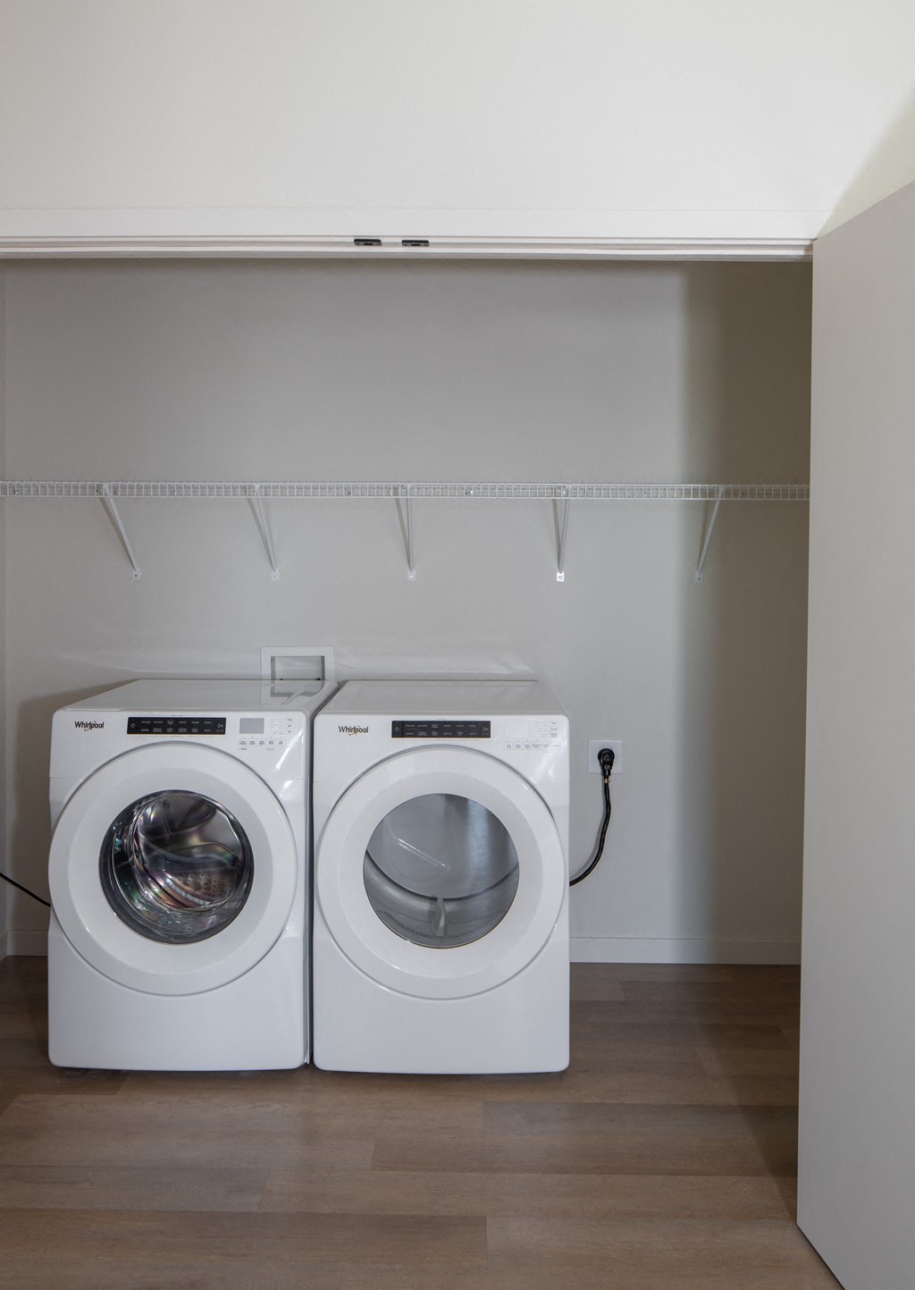 a washer and dryer in a laundry room at Riverhouse Apartments, Fargo, North Dakota 58102
