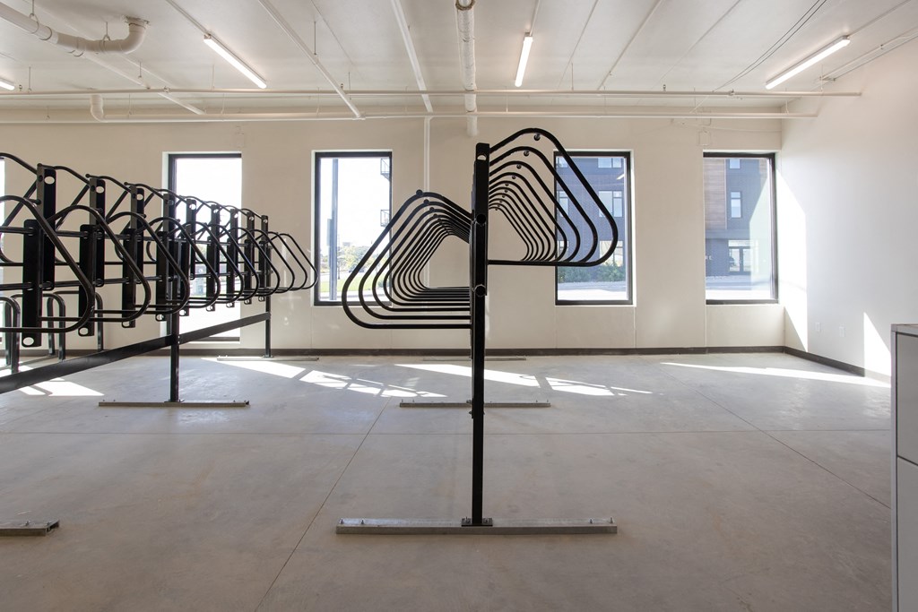 a room with a row of sculptures in the middle of it at Riverhouse Apartments, Fargo, North Dakota 58102