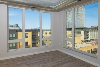 Interior with wooden floors and view Interior with wooden floors and view at Kesler Apartments in Downtown Fargo, North Dakota - Photo Gallery 6