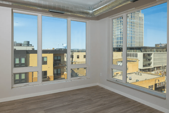 Large windows with view of cityscape at Kesler Apartments in Downtown Fargo, Fargo, North Dakota