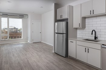 Kitchen with cabinets at Kesler Apartments in Downtown Fargo, North Dakota - Photo Gallery 4