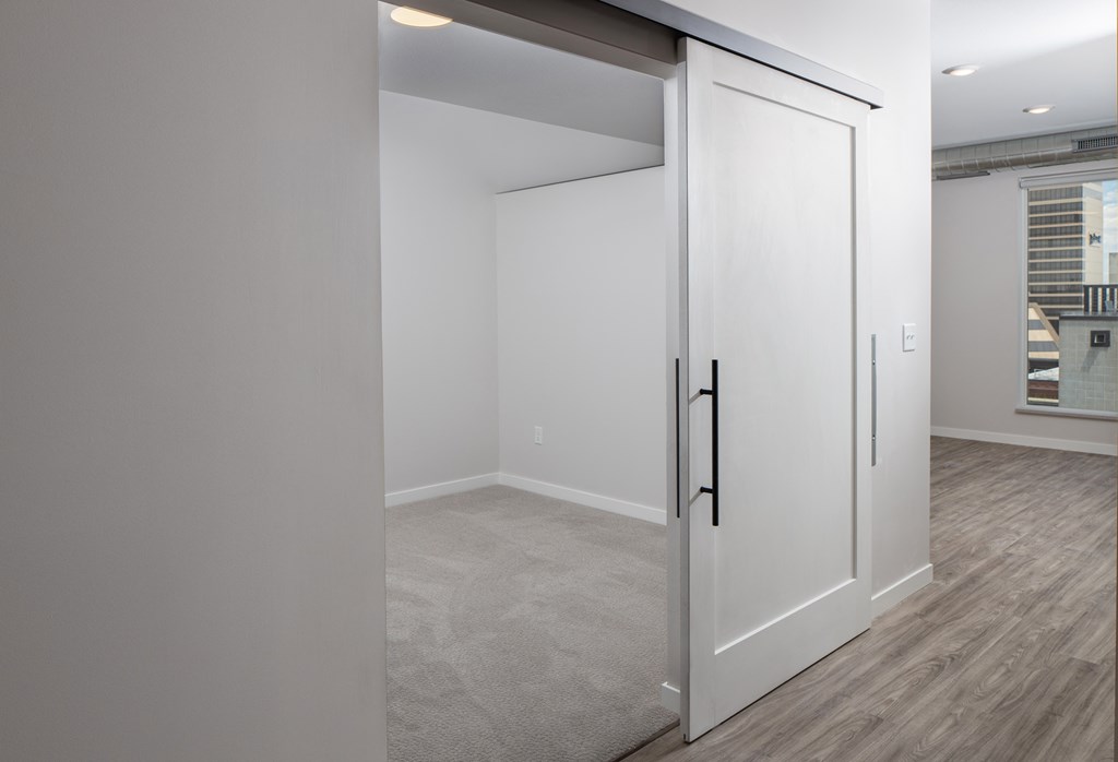 Sliding Farm Doors Spacious Rooms with White Sliding Farm Doors at Kesler Apartments in Downtown Fargo, Fargo ND 58102