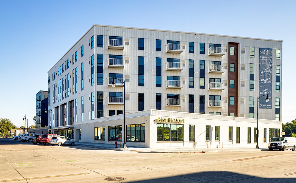 a new apartment building on the corner of a city street at Riverhouse Apartments, North Dakota