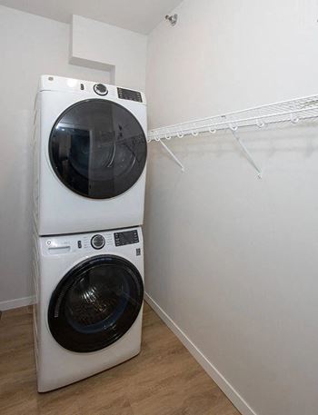 a washing machine and a dryer in a room at Mercantile on Broadway, Fargo, ND 58102