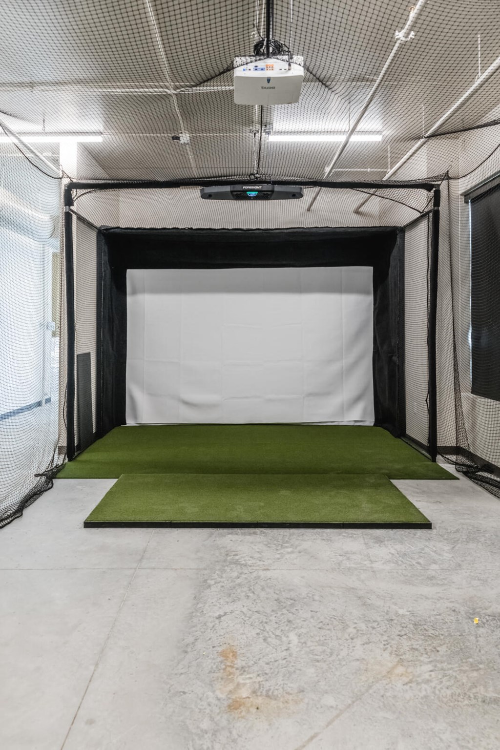 a green carpet on the floor of a parking at Riverhouse Apartments, North Dakota