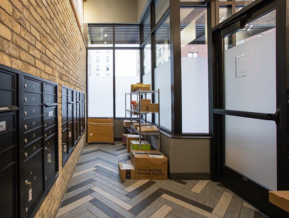 a room with a chevron floor and a whiteboard on the wall  at RoCo Apartments, Fargo, ND, 58102