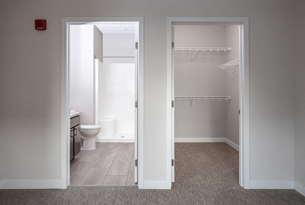 a bathroom with a toilet and a sink at RoCo Apartments, Fargo, ND 58102