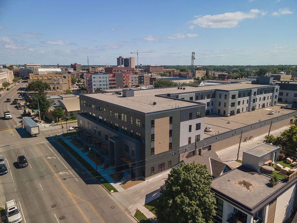 an aerial view of a large building in a city at The Landing at 1001 NP, Fargo, ND 58102